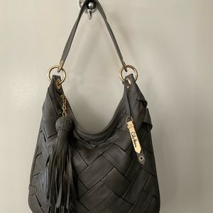 Cole Haan bag. gray leather, with gold hardware.